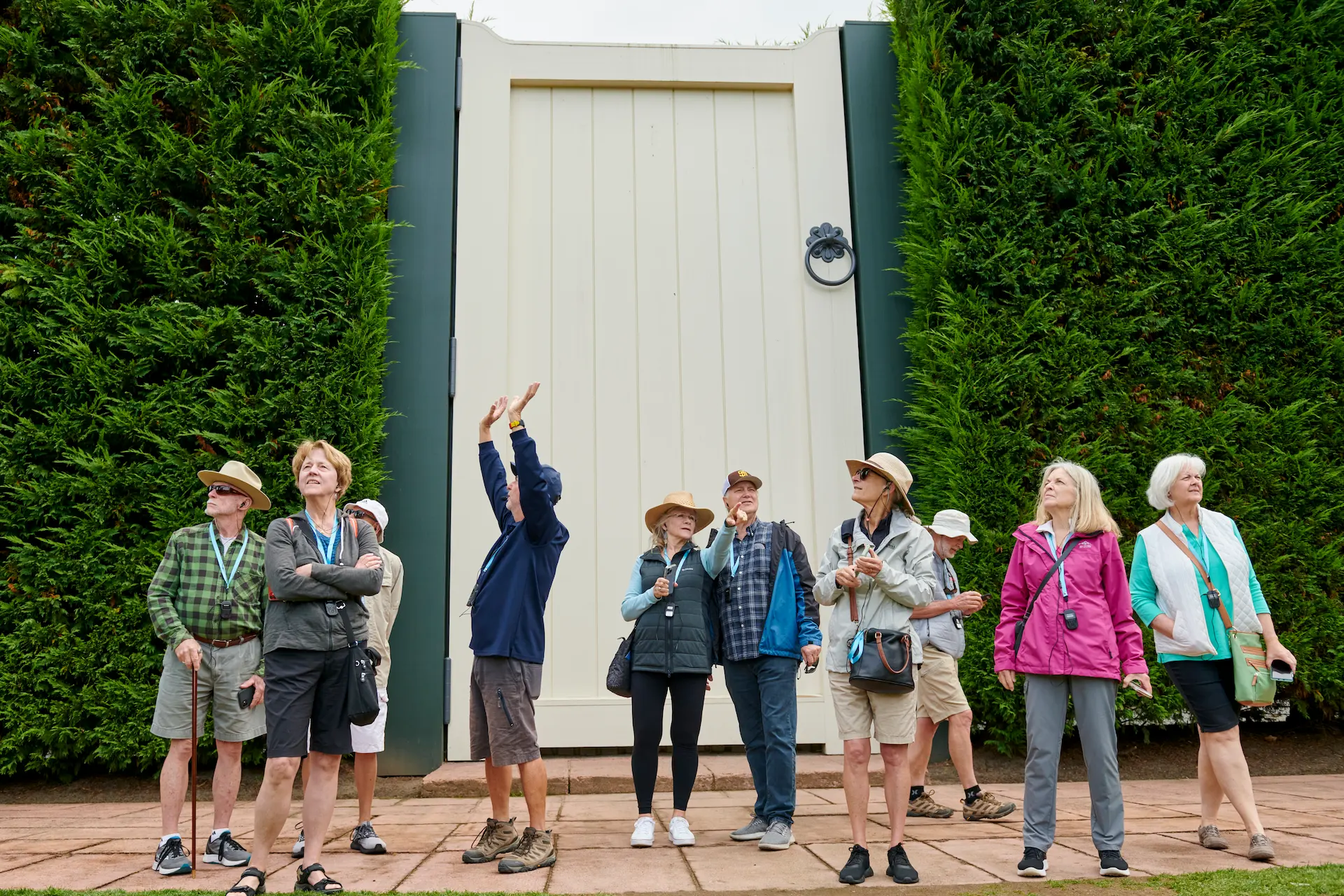A large group of people on a guided tour at Hamilton gardens